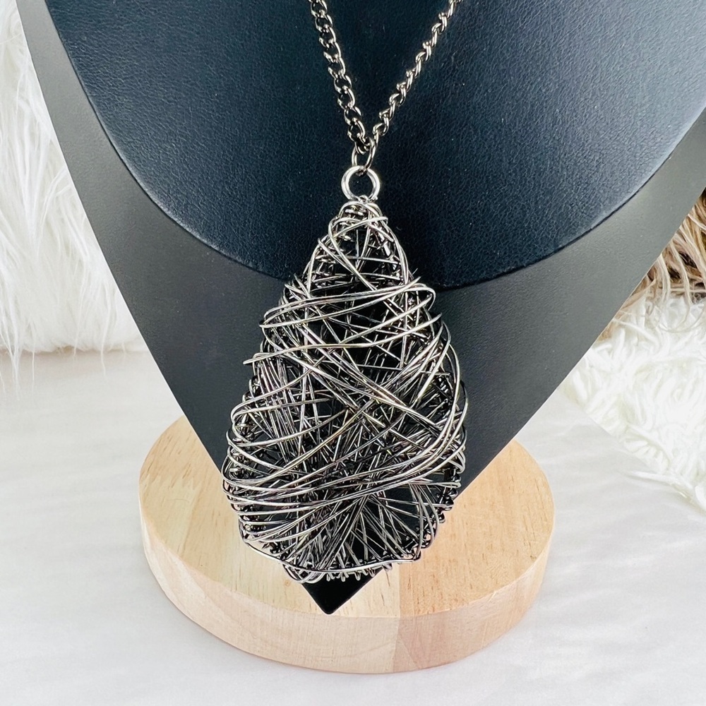 Long gunmetal necklace with large wire, twisted pendant
